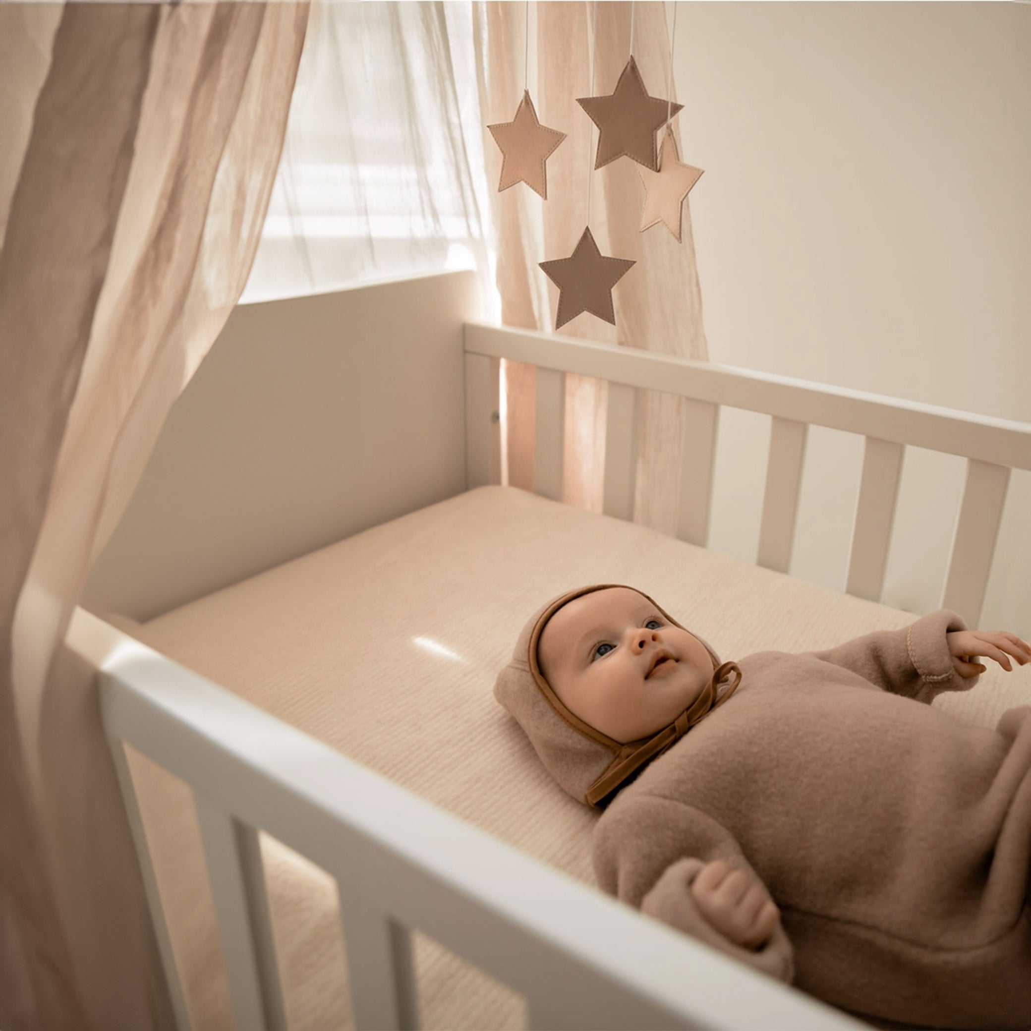 Tutina da neonato realizzata al 100% in morbidissima lana merino