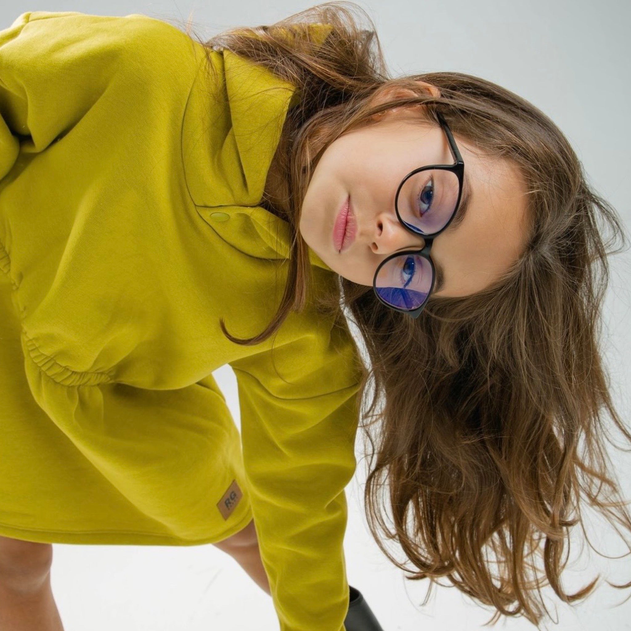 Dress with elastic waistband and hood with snap buttons