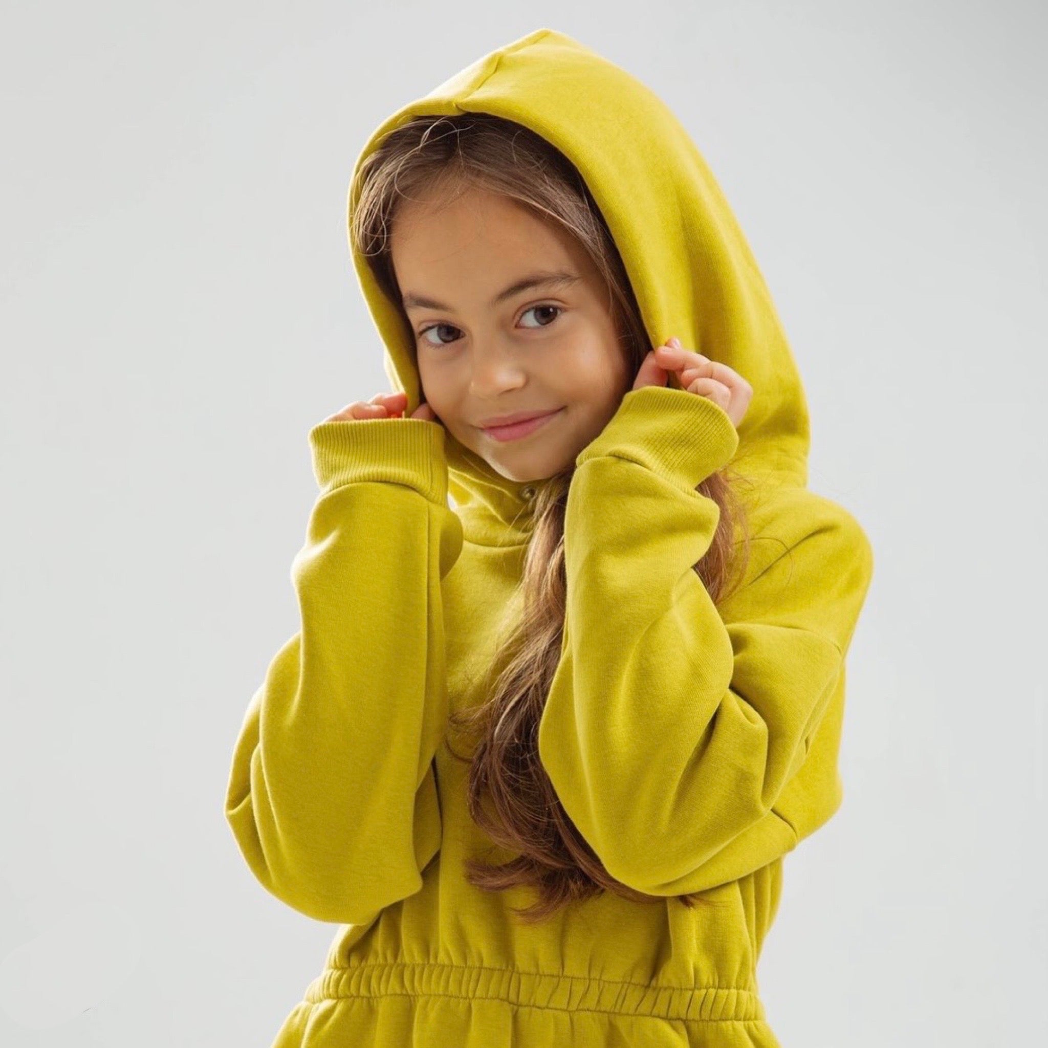 Dress with elastic waistband and hood with snap buttons