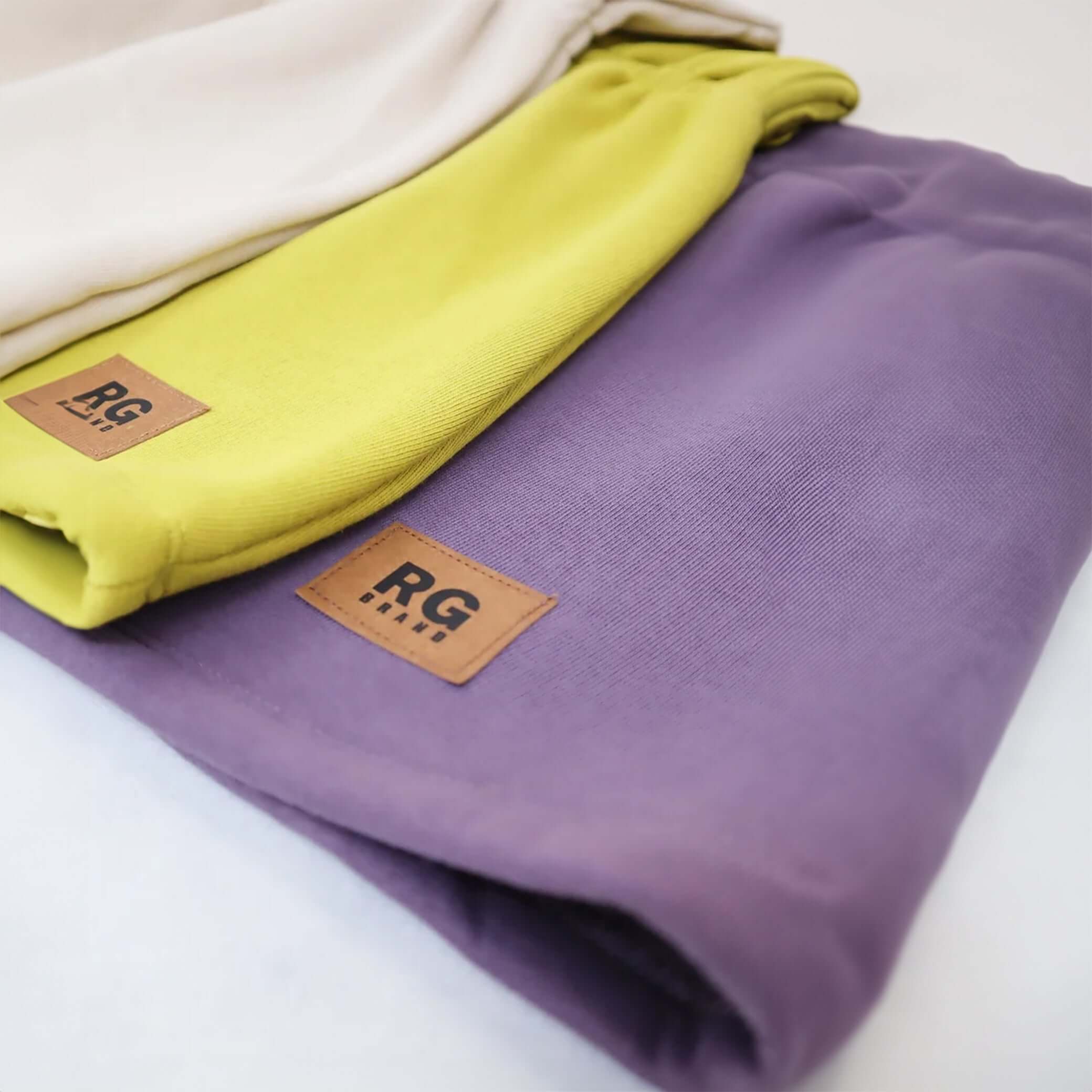 Dress with elastic waistband and hood with snap buttons