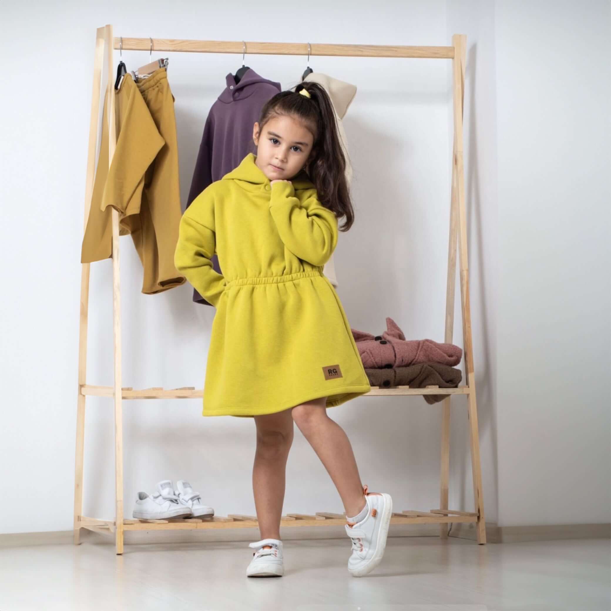 Dress with elastic waistband and hood with snap buttons