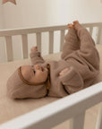 Tutina da neonato realizzata al 100% in morbidissima lana merino