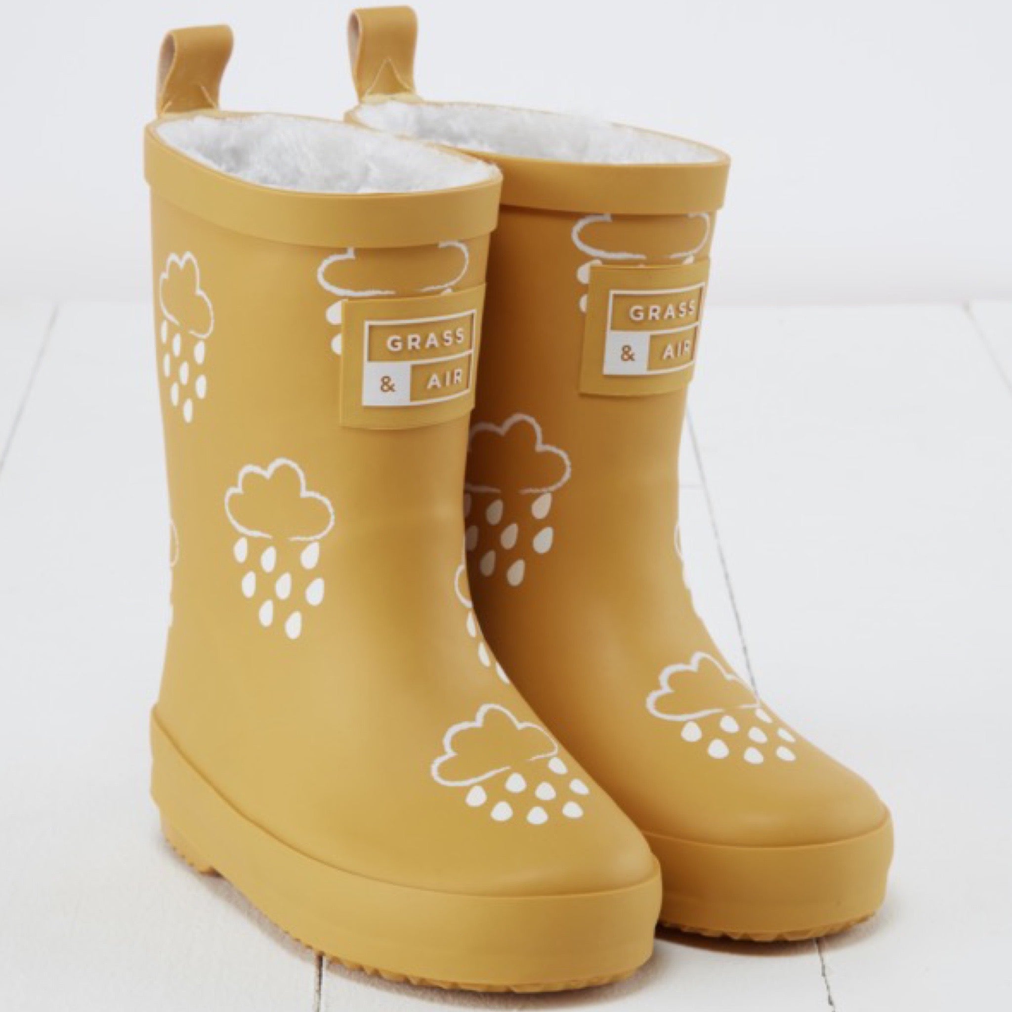 Ocher colored winter rubber boots with color changing